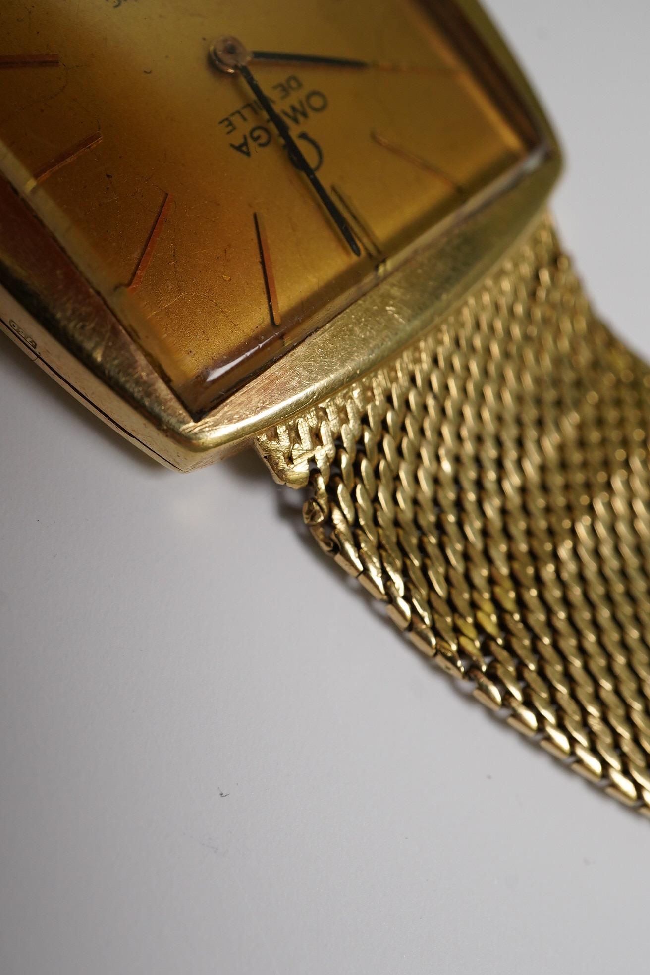 A gentleman's early 1960's 18ct gold Omega De Ville automatic dress wrist watch, on integral Omega 18ct gold mesh link bracelet